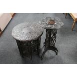 Two early 20th century heavily carved folding Eastern tables