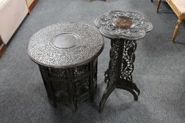 Two early 20th century heavily carved folding Eastern tables
