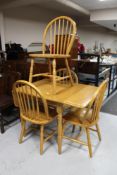 A plantation rubber wood drop leaf kitchen table and four chairs