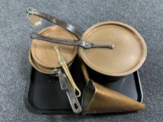 A tray of two antique copper cast iron handled pans with lids together with a further pan lid and a