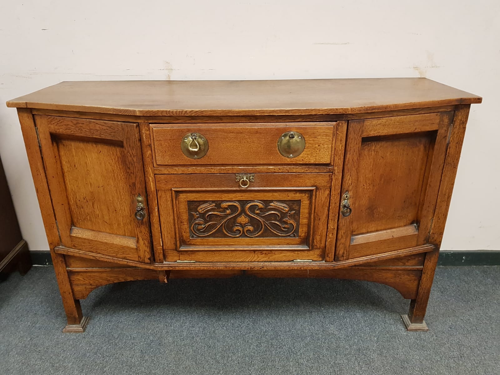 An Arts & Crafts oak sideboard,