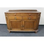 An early 20th century oak double door sideboard.