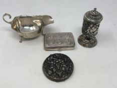 A silver compact, sauce boat,