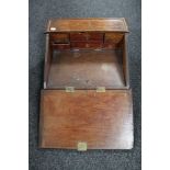 An antique oak table top clerk's desk fitted six internal drawers