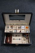 A jewellery box containing Baltic amber jewellery, cherry amber style necklace,