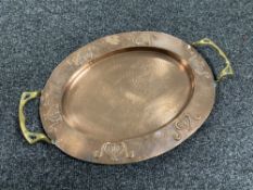 An Art Nouveau copper tray with brass handles, 39.5 cm x 26 cm.