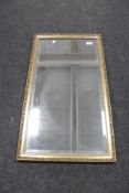 A gilt framed mirror.