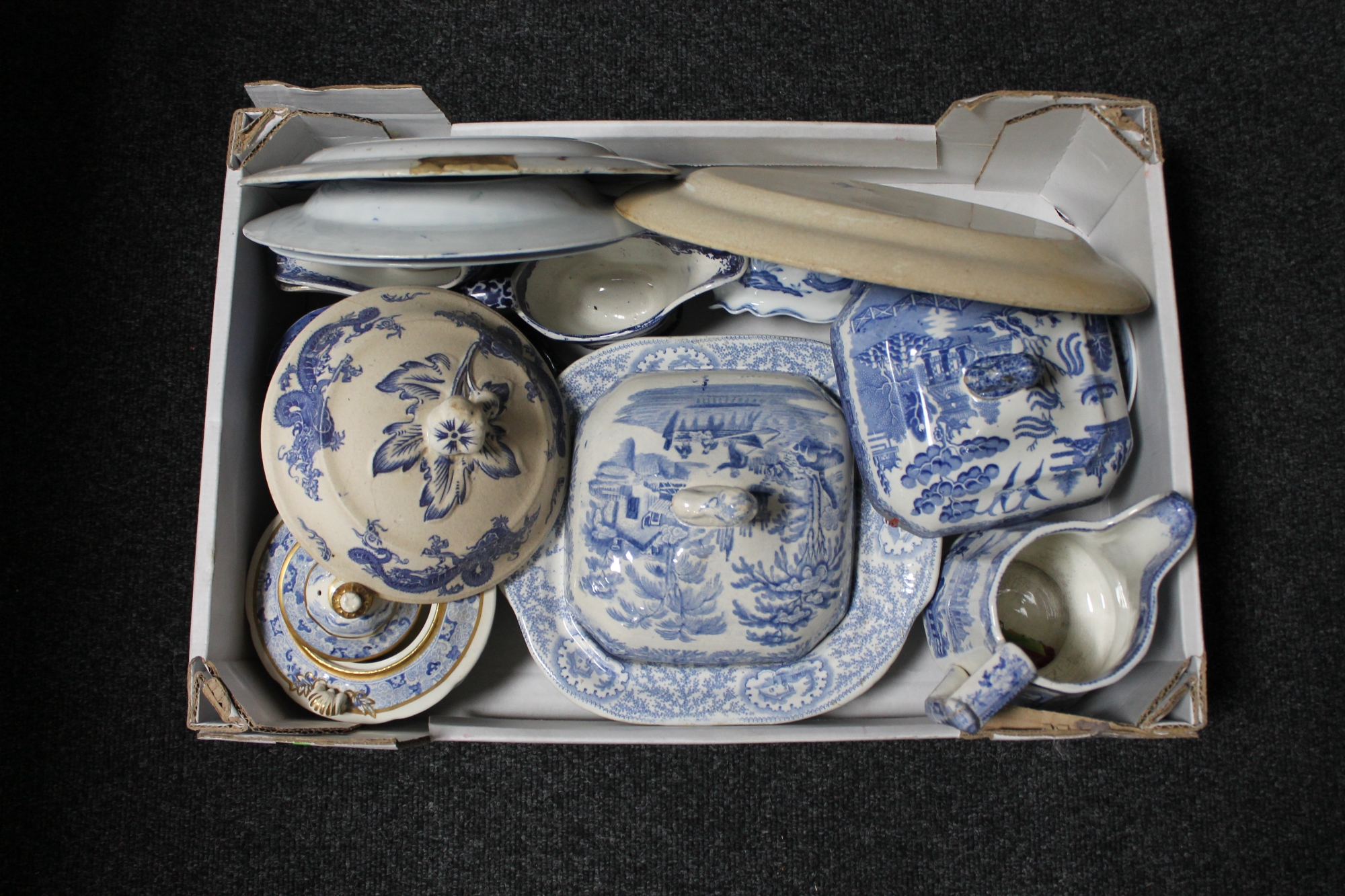 A box of antique English blue and white china, meat plates, tureens,