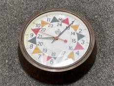 A Bakelite cased circular wall clock with later 'RAF' sector dial