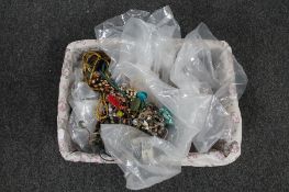 A basket of various costume jewellery