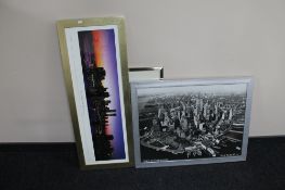 A framed colour print of the New York skyline, black and white framed of Downtown New York,