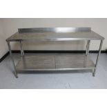 A stainless steel two tier prep table.