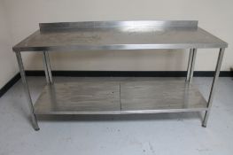 A stainless steel two tier prep table.