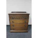 A 20th century oak four drawer chest.