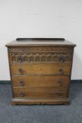 A 20th century oak four drawer chest.