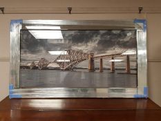 A framed print of a bridge,