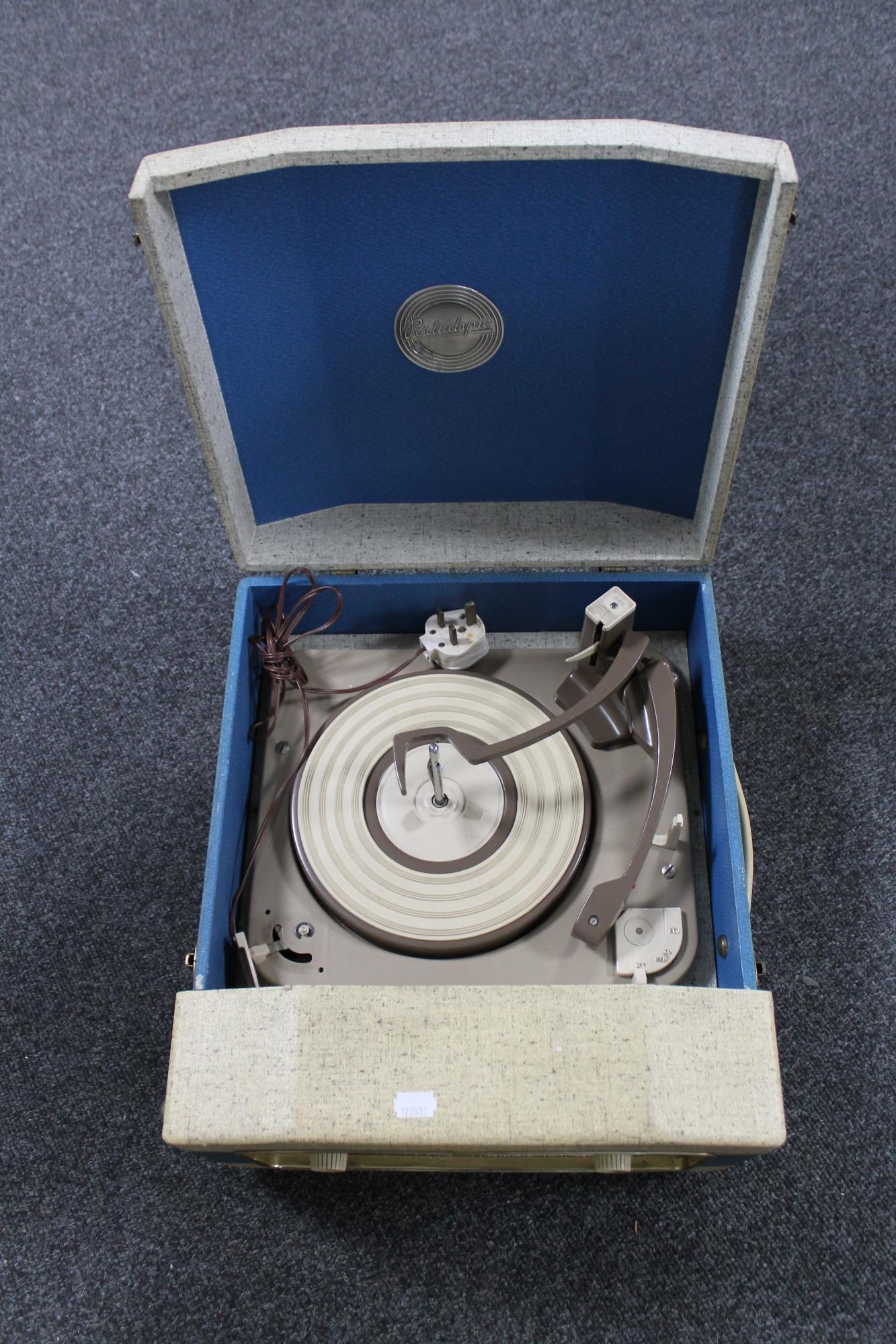 A table top Portadyne electric record player