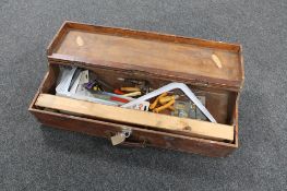 A 20th century wooden joiner's box containing hand tools and metal shelf brackets