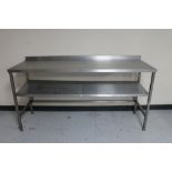 A stainless steel two tier prep table.