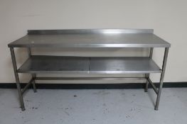 A stainless steel two tier prep table.