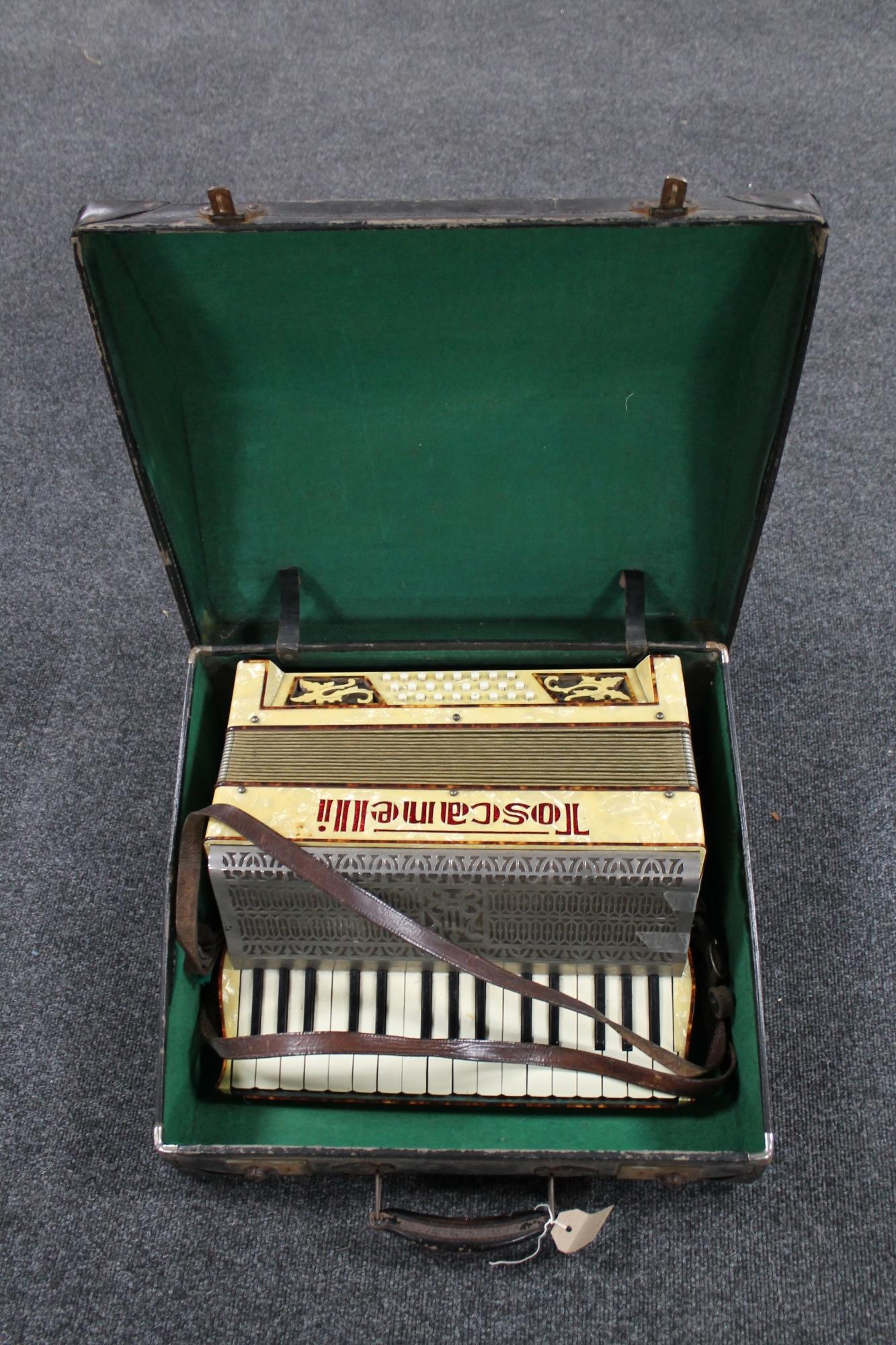 An Italian piano accordion in carry case.