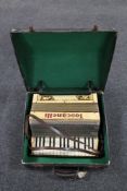 An Italian piano accordion in carry case.