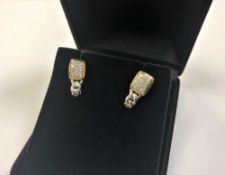 A pair of 10ct gold diamond set earrings