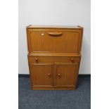 A 20th century teak cocktail cabinet