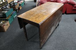 A Georgian oak drop leaf table.