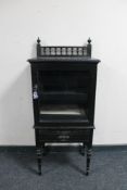 An Edwardian ebonised music cabinet.