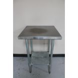 A square stainless steel two tier prep table