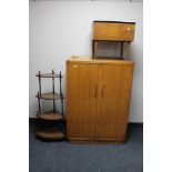 A 1930's oak gentleman's wardrobe, corner what not stand and a teak storage footstool.