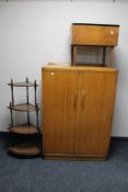 A 1930's oak gentleman's wardrobe, corner what not stand and a teak storage footstool.