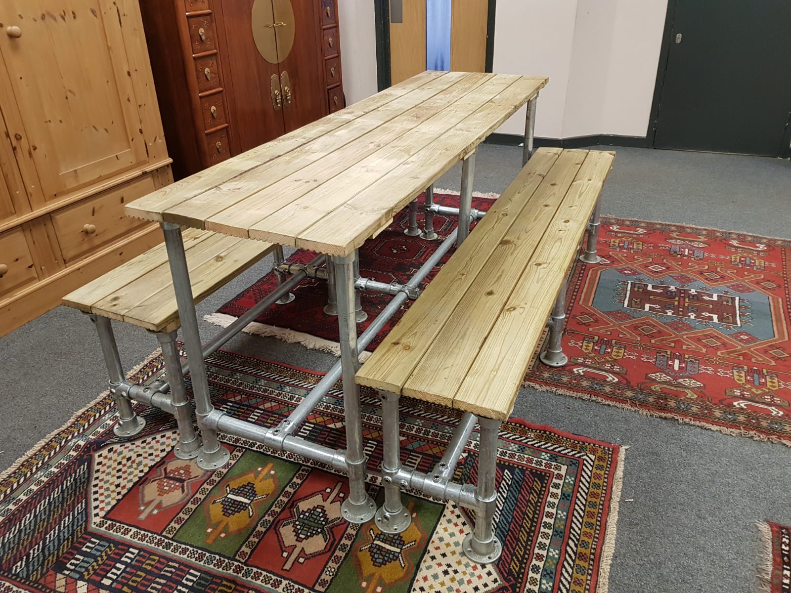 A reclaimed scaffolding table and bench set,