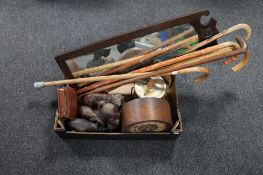 A box of Edwardian mahogany framed mirror, assorted walking sticks, wooden animal figures,