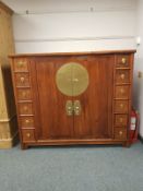 A Chinese elm double door brass mounted storage cabinet,