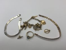 A collection of 9ct gold jewellery including charm bracelet and loose charms, three-tone bracelet,