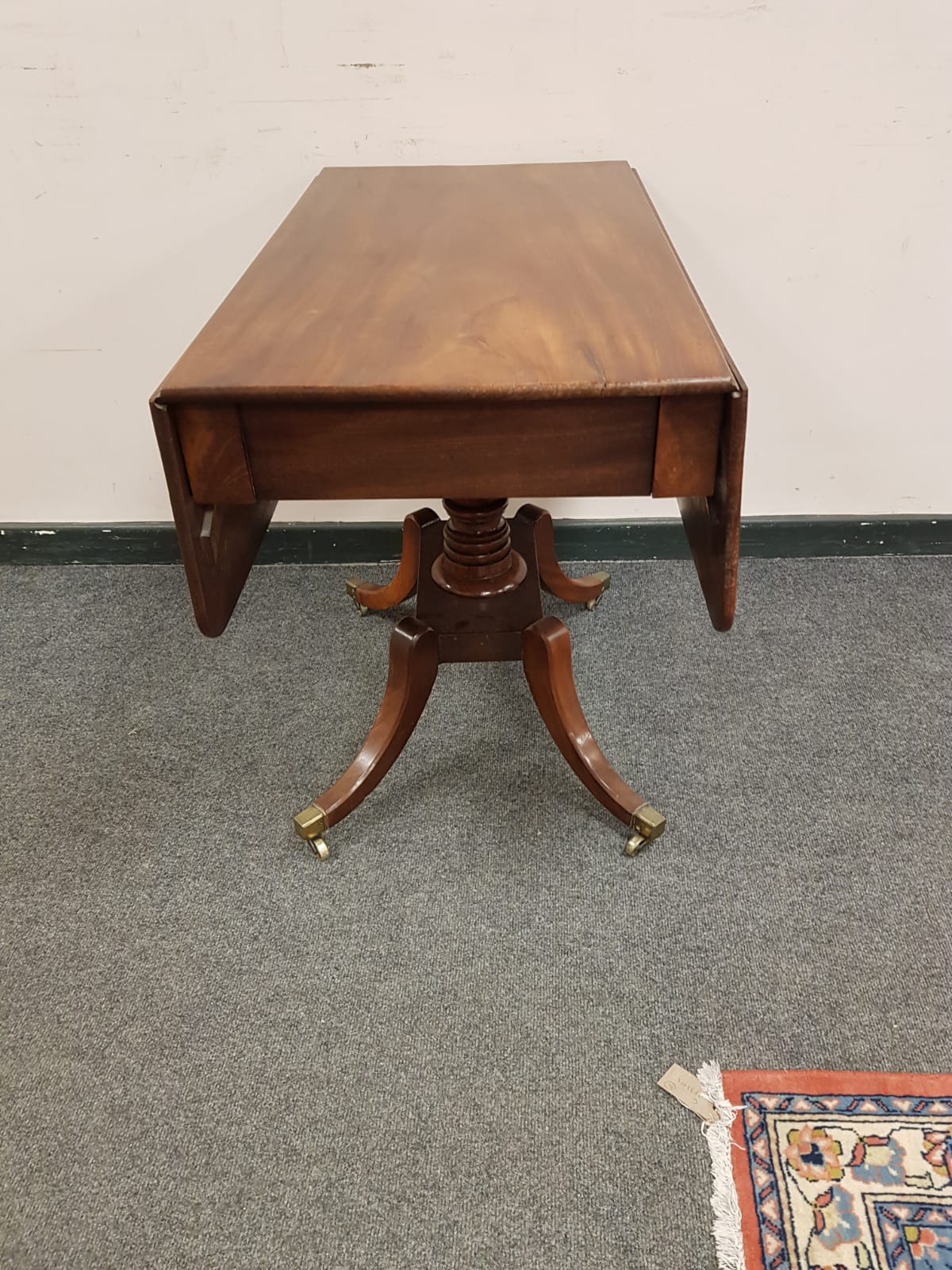 A 19th century flap sided pedestal table,