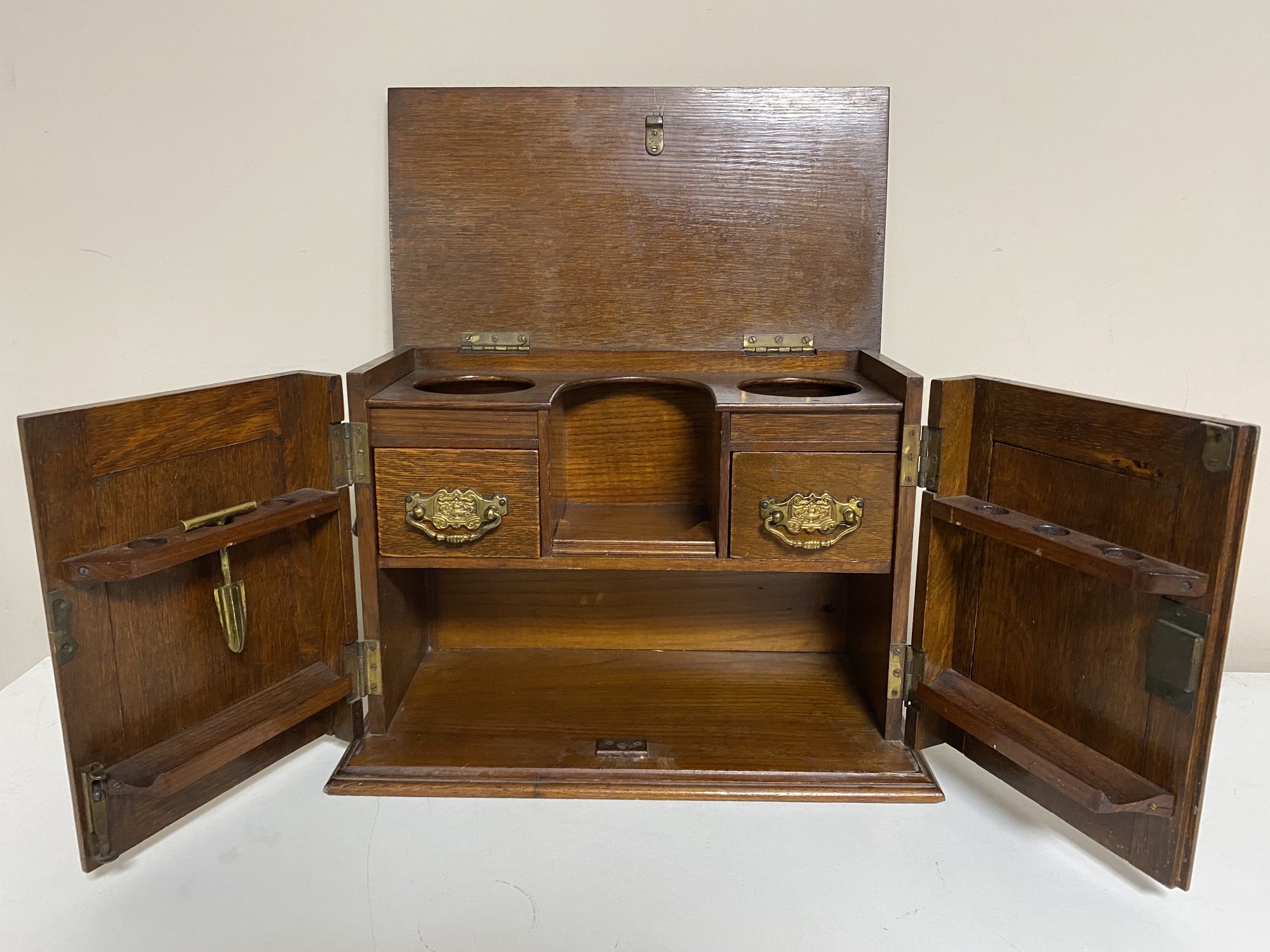 An Edwardian oak smoker's cabinet