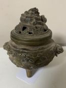 A small Chinese bronze censer, diameter approximately 11 cm.