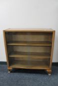 A set of mid 20th century walnut sliding door shelves.