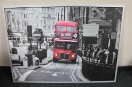 A large Ikea framed print of a London bus