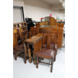 A 1930's six piece oak dining room suite : mirror backed sideboard, drop leaf table and four chairs.