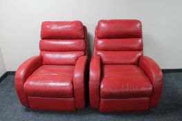 A pair of red leather Laz-y-Boy armchairs.
