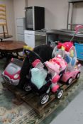 A pallet of children's toys including electric car, Fisher Price trike, doll's pram, soft toys etc.