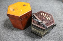 An antique English concertina with rosewood fretwork ends labelled Lachenal & Co,