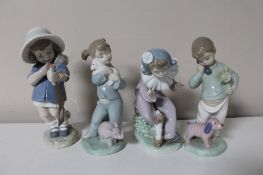 Four Nao figures, girls with flower, girl with lamb etc.