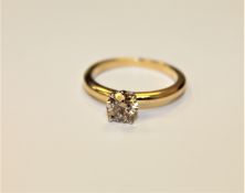 An 18ct gold solitaire diamond ring, the brilliant cut stone weighing approximately 1.
