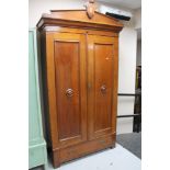 A 19th century continental mahogany double door wardrobe fitted with a drawer