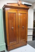 A 19th century continental mahogany double door wardrobe fitted with a drawer